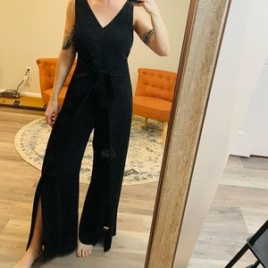 Black romper Antonio Melani open slits in front w/ front bow that tightens waist
